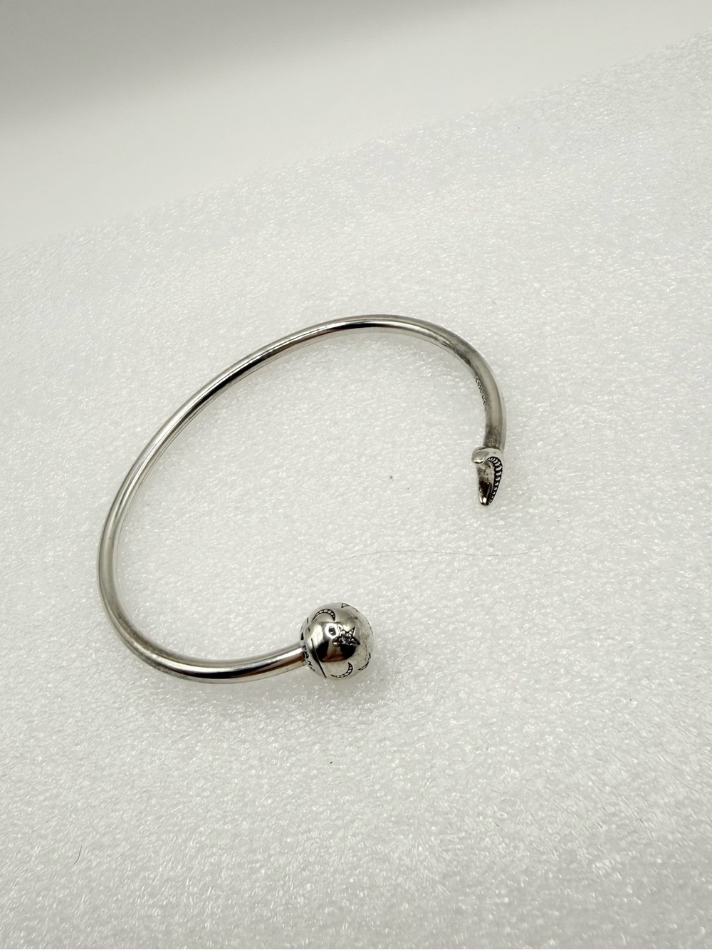 This Pandora Moments Moon & Stars Open Bangle sterling silver